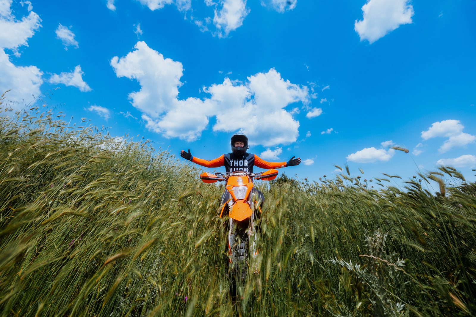 Lukas and Saki, the guides of Gods of Hard Enduro, in the fields near Isoma